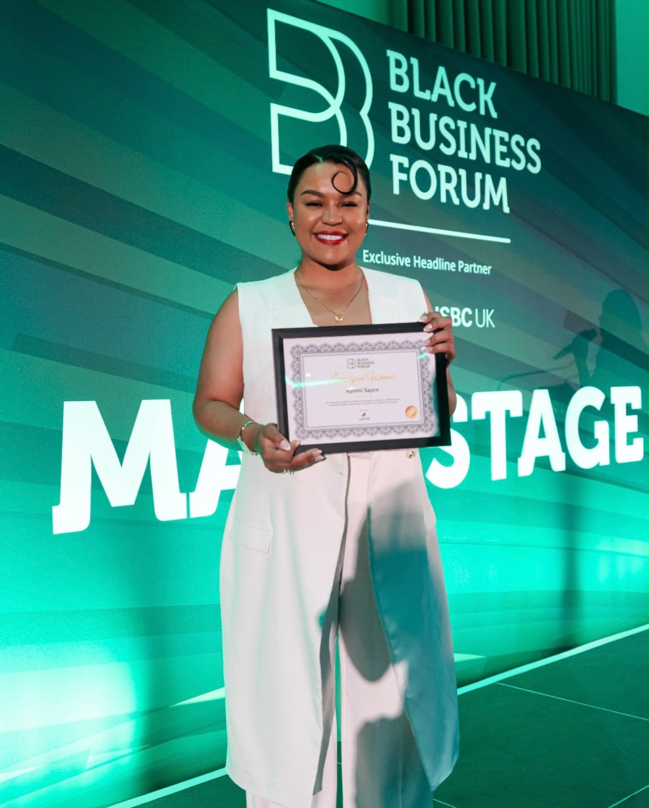 Kyomi Sayce receiving recognition at the Black Business Forum